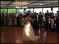 bride and groom dancing, surrounded by their wedding guests