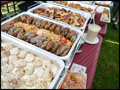 buffet style catering at a corporate bbq featuring our grilled sausage and peppers and home made chicken meatballs