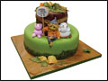 fondant covered autumn theme birthday cake with a scarecrow, sheep and a pig