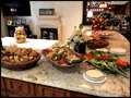 Our delicious catered appetizer platters are displayed on a marble island